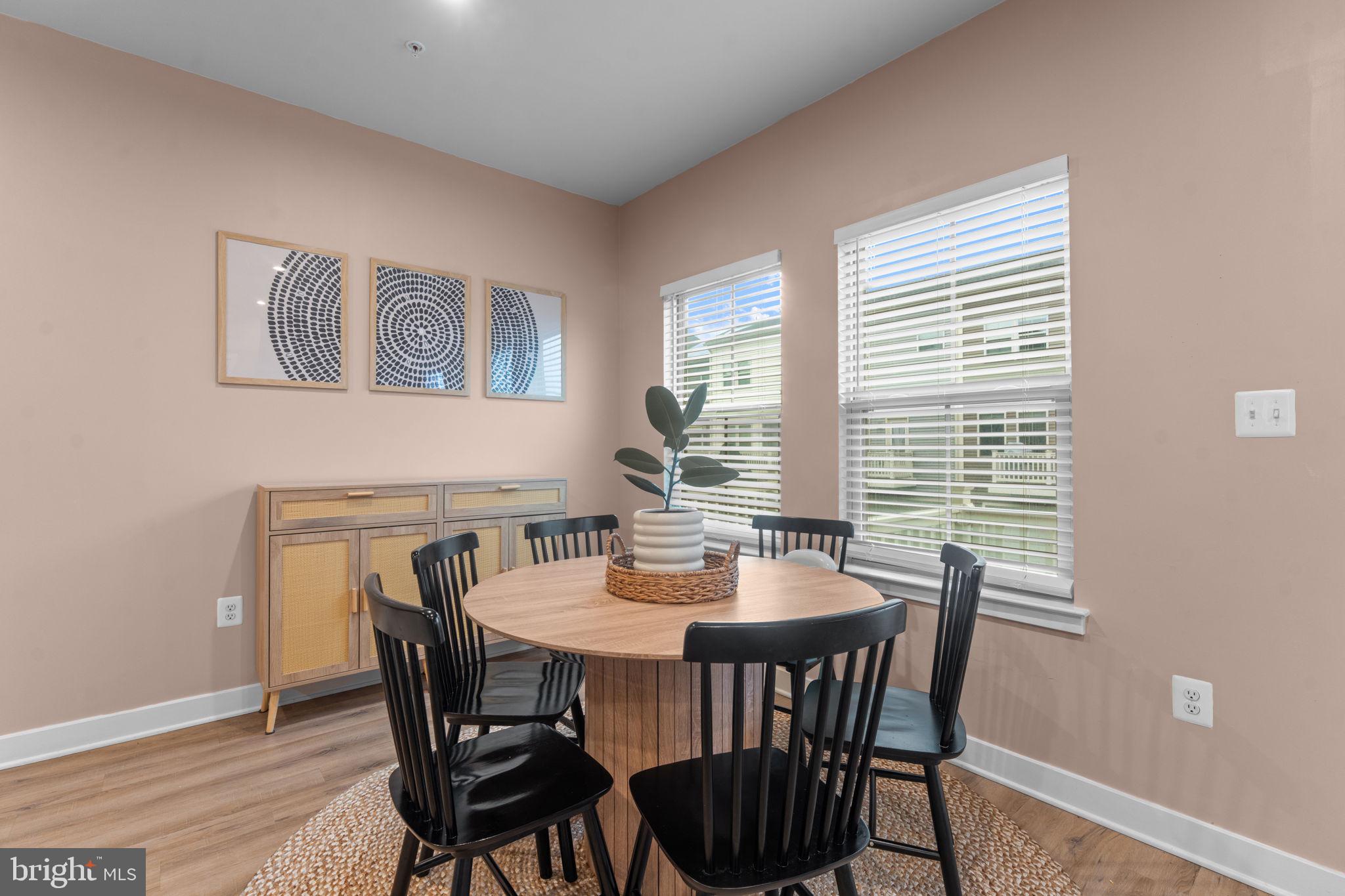 160 Lyons Creek Drive Laurel, MD 20708 - Photo 31 of 88 a view of a dining room with furniture window and wooden floor