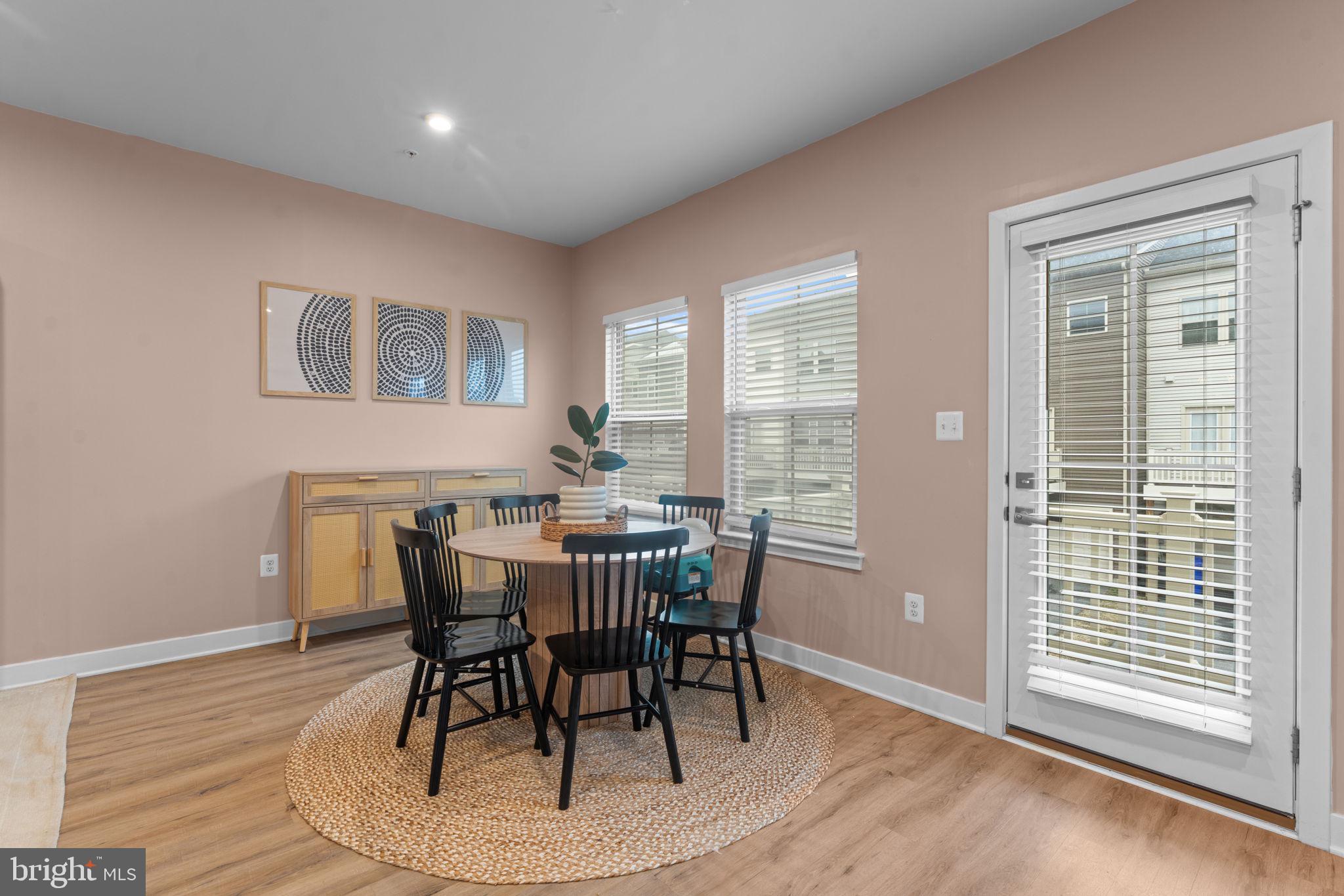 160 Lyons Creek Drive Laurel, MD 20708 - Photo 32 of 88 a view of a dining room with furniture window and wooden floor