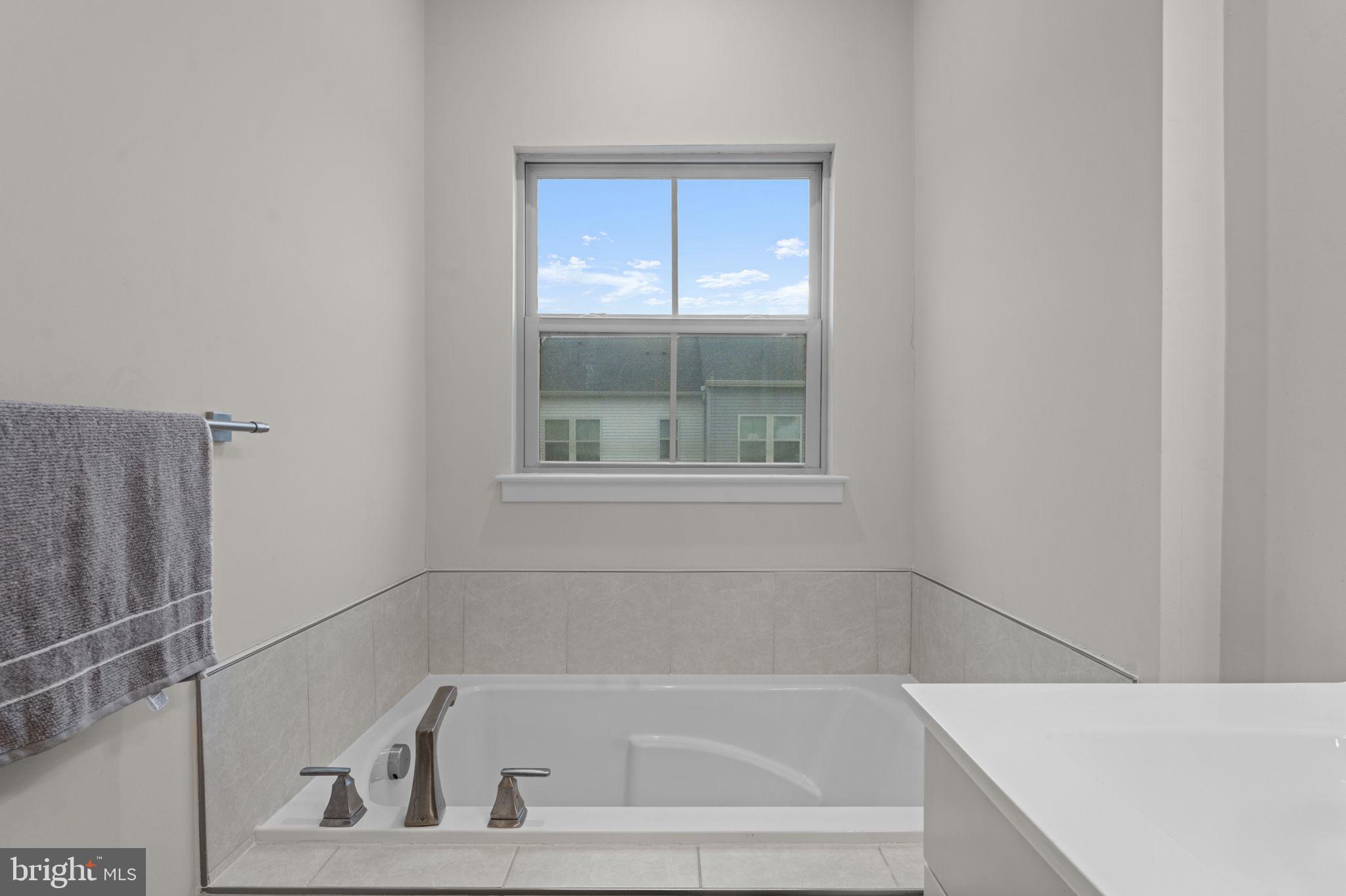 160 Lyons Creek Drive Laurel, MD 20708 - Photo 43 of 88 a white bath tub sitting next to a window