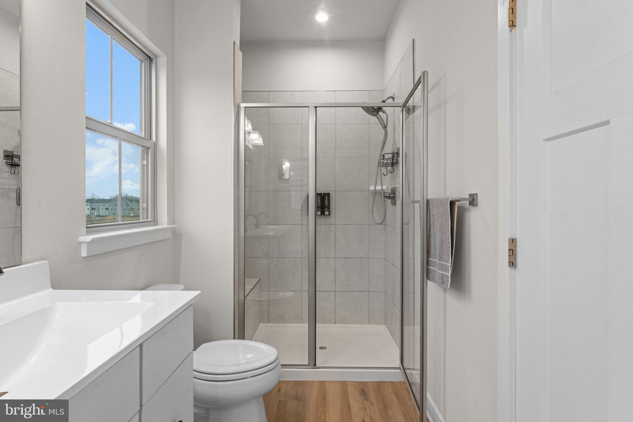 160 Lyons Creek Drive Laurel, MD 20708 - Photo 44 of 88 a bathroom with a sink toilet and shower