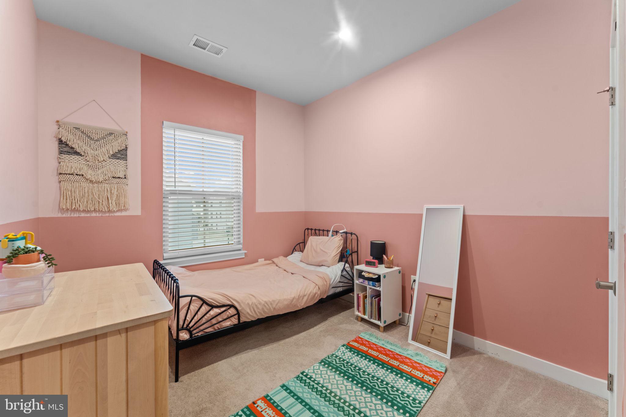 160 Lyons Creek Drive Laurel, MD 20708 - Photo 51 of 88 a bedroom with a bed and wooden floor