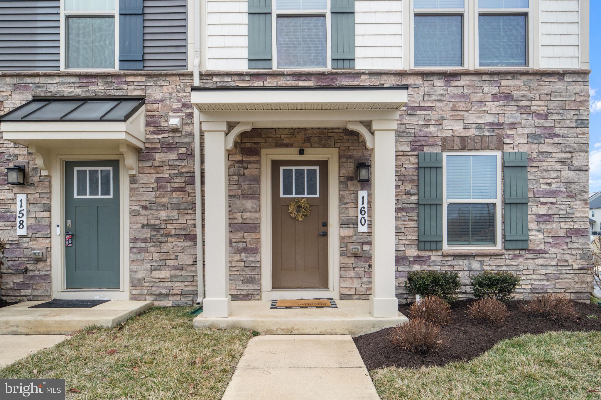 160 Lyons Creek Drive Laurel, MD 20708 - Photo 6 of 88 a front view of a house with a garden
