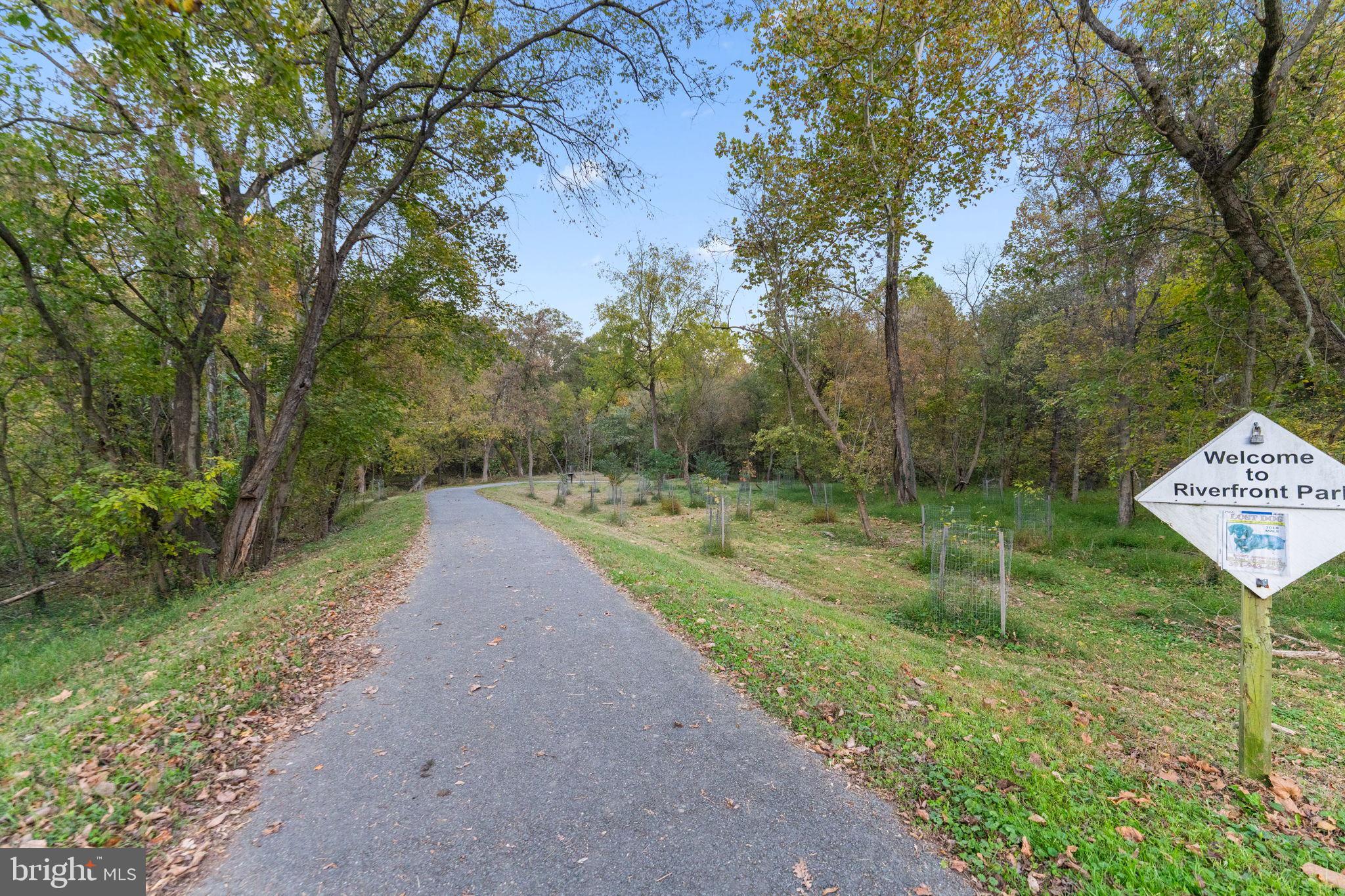 160 Lyons Creek Drive Laurel, MD 20708 - Photo 86 of 88 a view of a street both of side of green space