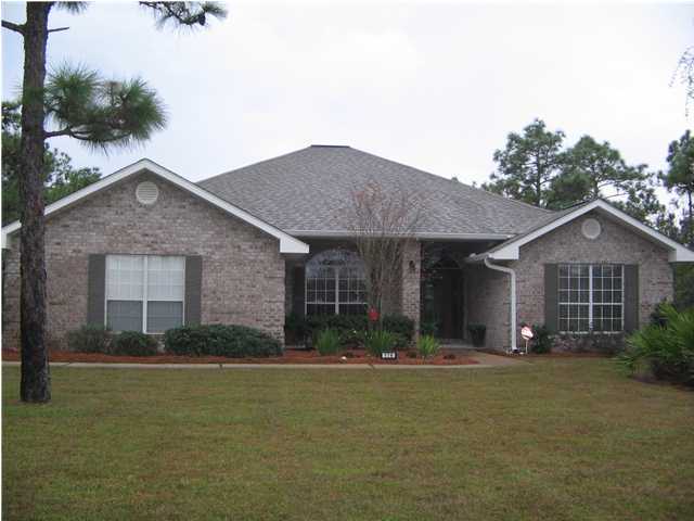 174 East Shipwreck Road Santa Rosa Beach, FL 32459 - Photo 1 of 11 a front view of a house with a yard