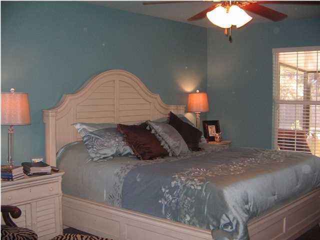 174 East Shipwreck Road Santa Rosa Beach, FL 32459 - Photo 8 of 11 a bed sitting in a bedroom next to a window
