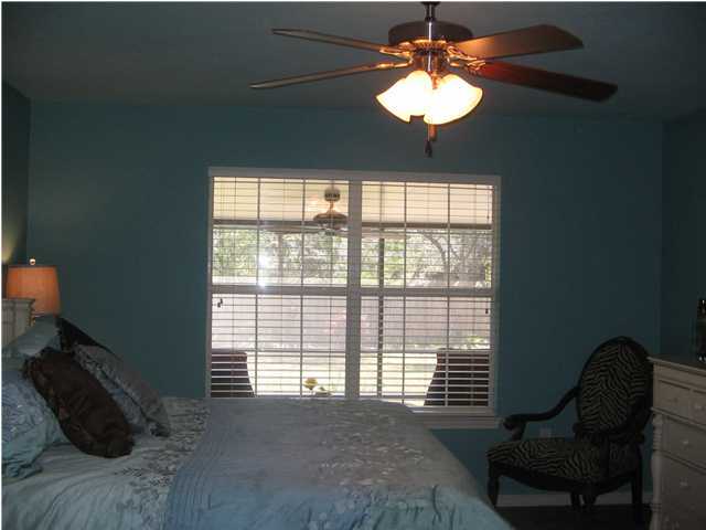 174 East Shipwreck Road Santa Rosa Beach, FL 32459 - Photo 9 of 11 a bed sitting in a bedroom next to a window
