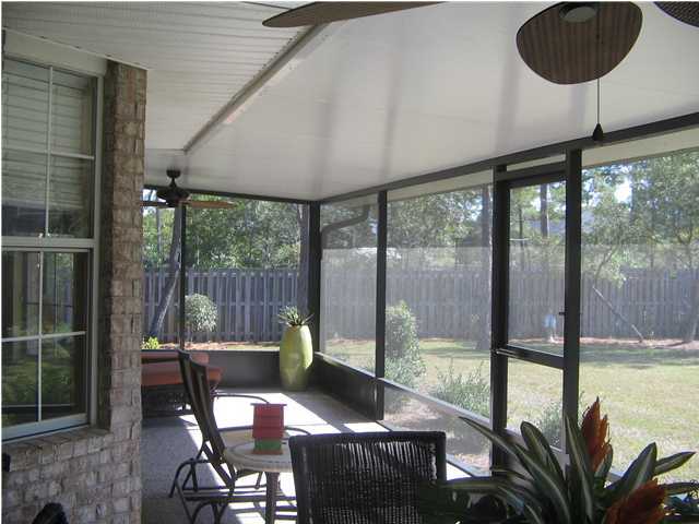 174 East Shipwreck Road Santa Rosa Beach, FL 32459 - Photo 10 of 11 a view of a porch with chairs and backyard