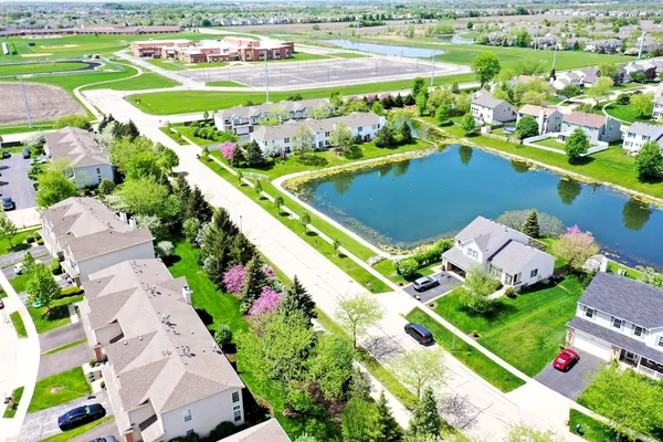 a view of a swimming pool with a yard