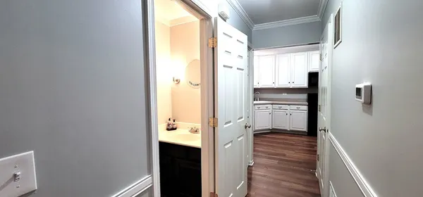 a view of a kitchen from the hallway