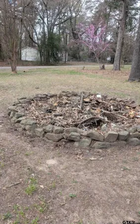 a view of outdoor space with trees all around