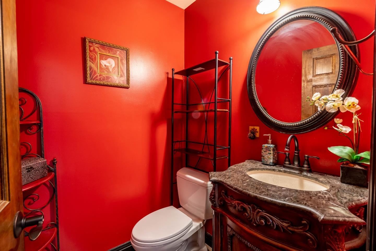 348 Heathcliff Drive Pacifica, CA 94044 - Photo 11 of 37 a bathroom with a granite countertop sink and a mirror