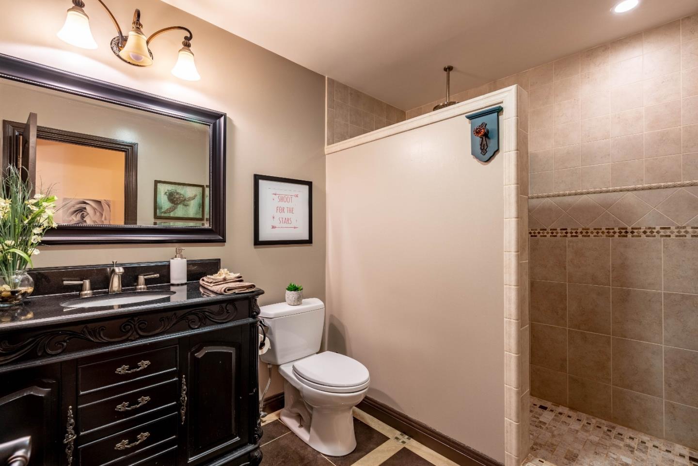 348 Heathcliff Drive Pacifica, CA 94044 - Photo 20 of 37 a bathroom with a toilet sink and mirror