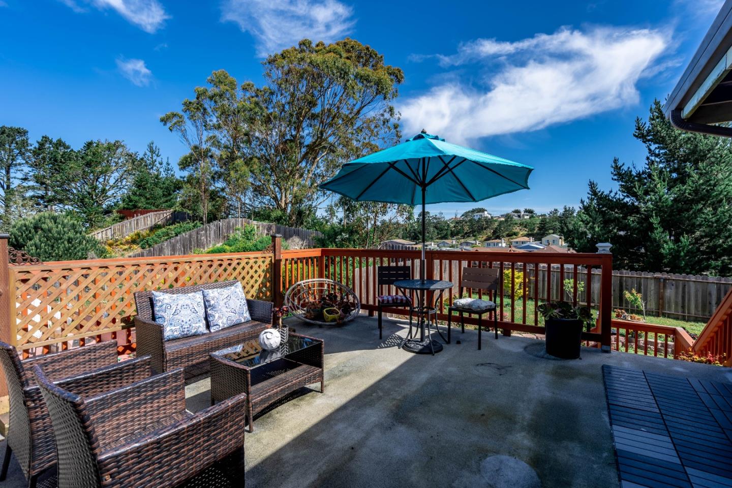 348 Heathcliff Drive Pacifica, CA 94044 - Photo 29 of 37 an outdoor sitting area with furniture and umbrella