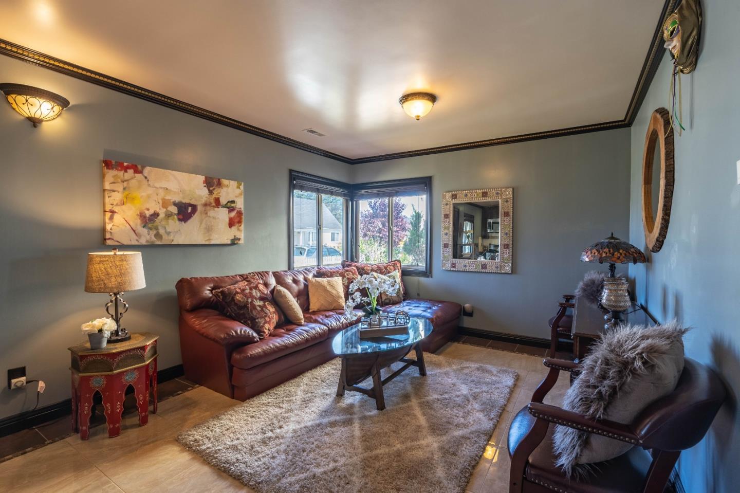 348 Heathcliff Drive Pacifica, CA 94044 - Photo 3 of 37 a living room with furniture and a flat screen tv