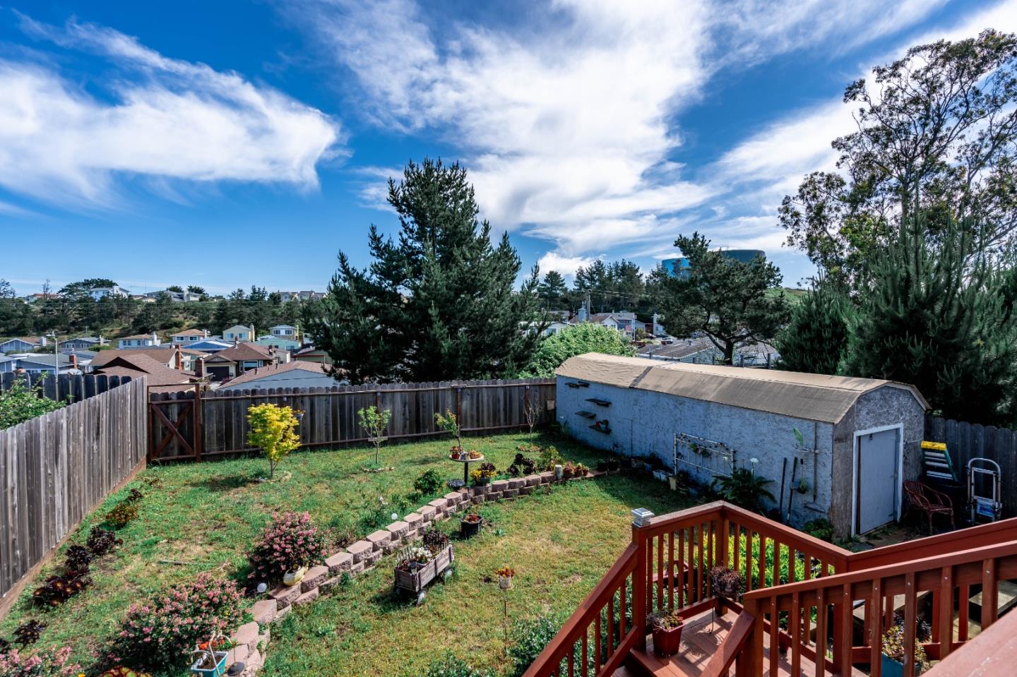 348 Heathcliff Drive Pacifica, CA 94044 - Photo 32 of 37 a view of a roof deck with wooden fence