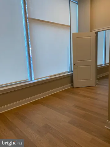 a view of room with wooden floor