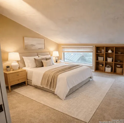 a bedroom with a bed and a large mirror