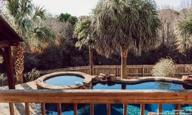 a view of swimming pool from a lake view