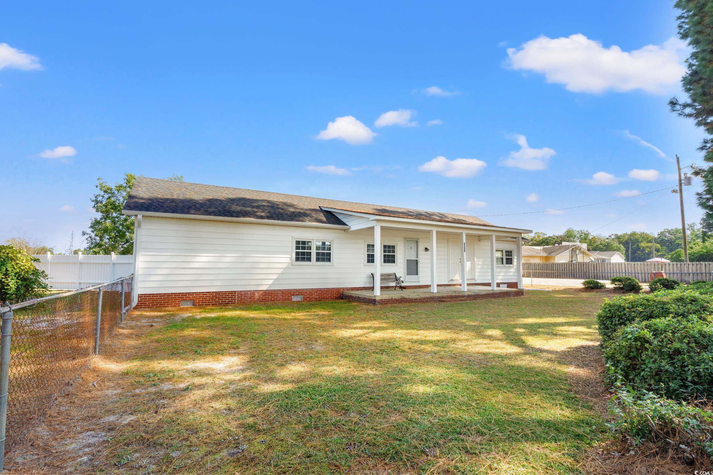 4422 Grady Road Mullins, SC 29574 - Photo 18 of 28 Back of house featuring a fenced backyard, crawl space, and a patio area