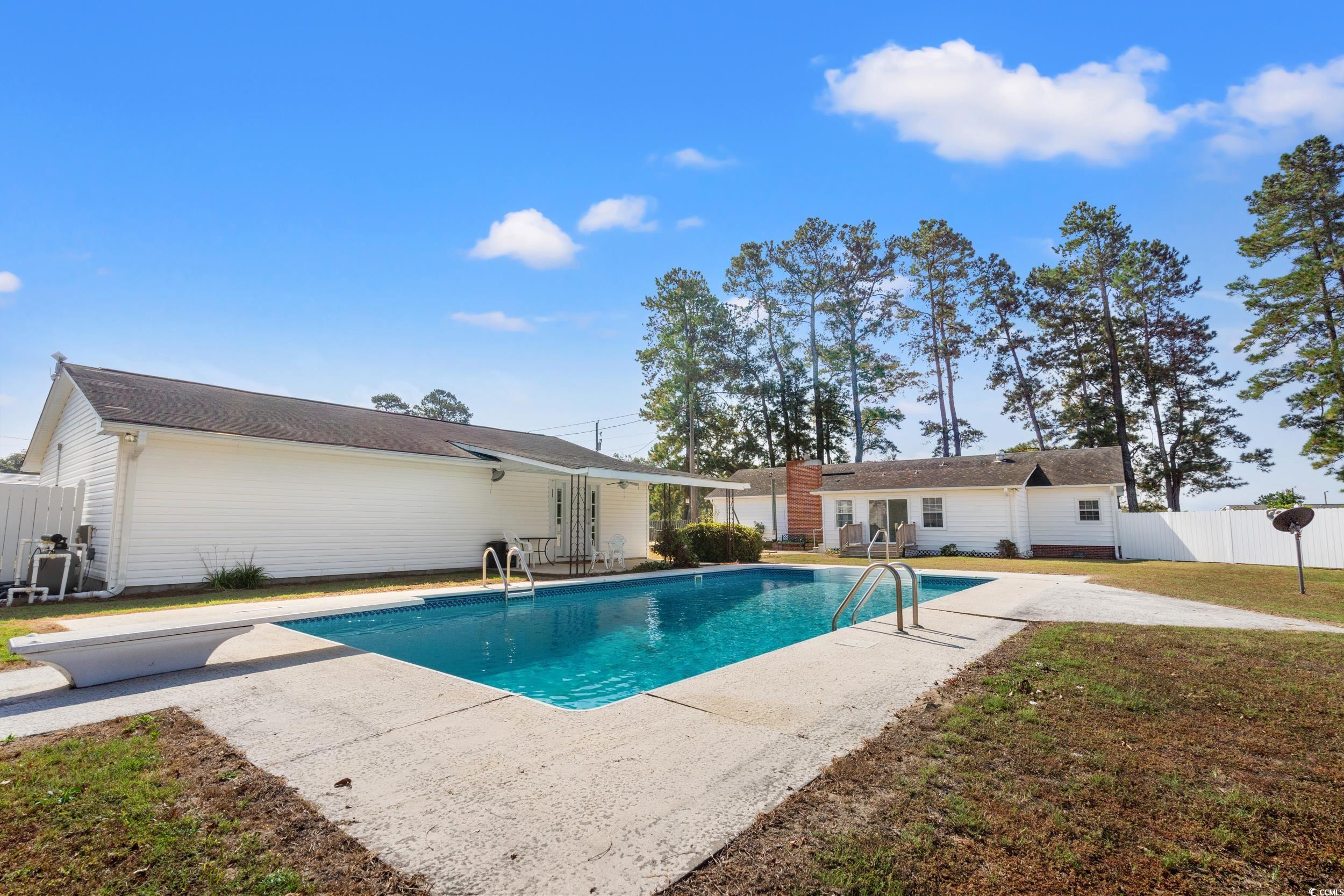 4422 Grady Road Mullins, SC 29574 - Photo 23 of 28 View of swimming pool with a patio area and french doors