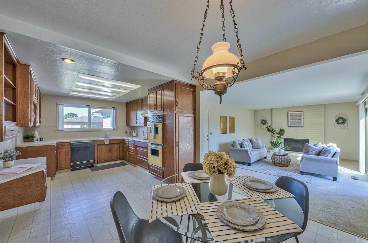 561 Palma Drive Salinas, CA 93901 - Photo 7 of 25 a dining room with furniture a chandelier and window
