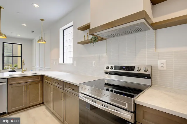 a kitchen with a stove and a sink