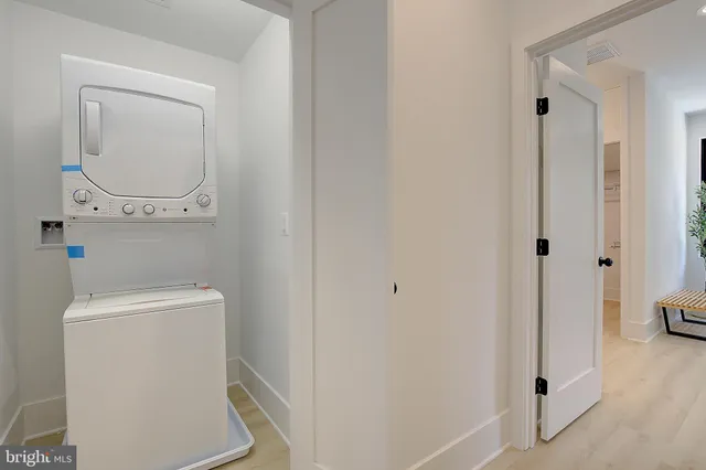 a bathroom with a toilet and a mirror