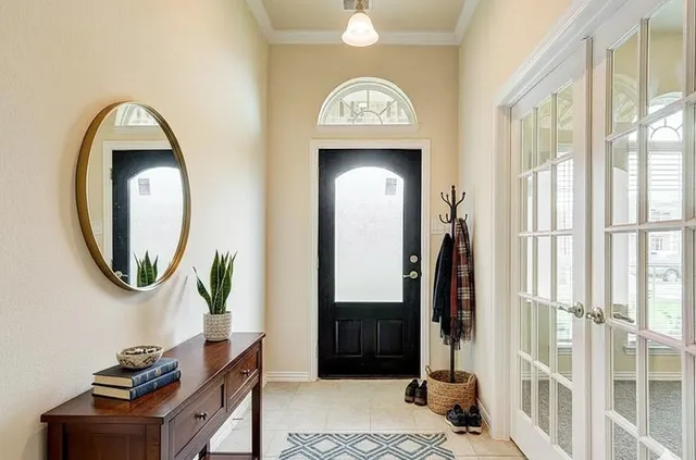 a view of a livingroom with furniture and a mirror