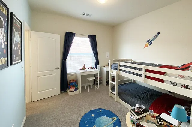 a living room with furniture a piano and a window