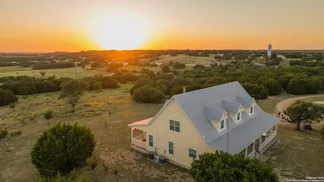 a view of a house with a mountain in the background