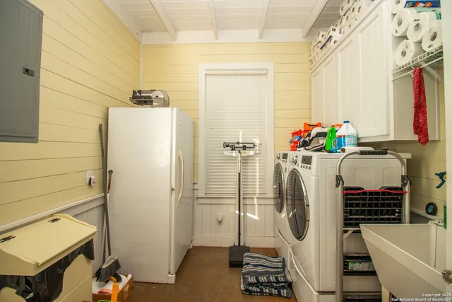 a bathroom with a granite countertop sink mirror vanity and toilet