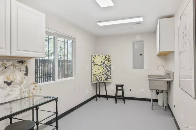 a view of room with window and furniture