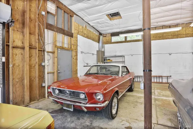 a bedroom with bed and a window