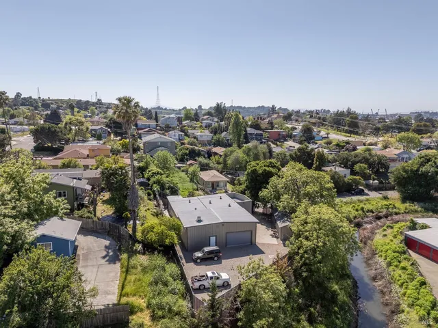 an aerial view of a house with a garden