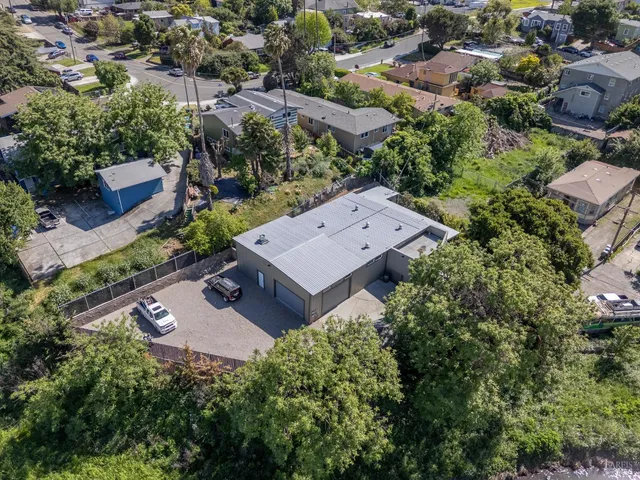 an aerial view of a house with yard and outdoor space