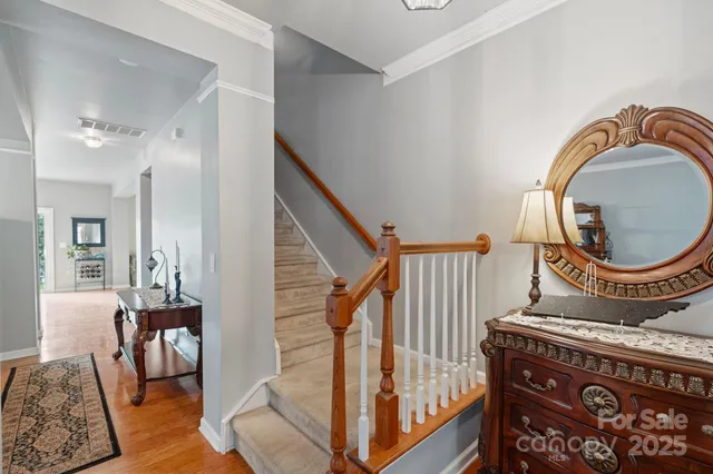 a view of living room with furniture and wooden floor