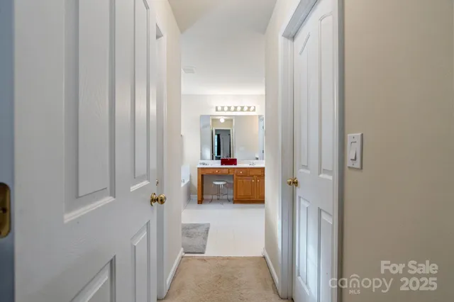 a view of a bathroom from the hallway