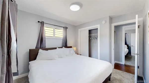 a bedroom with bed and window