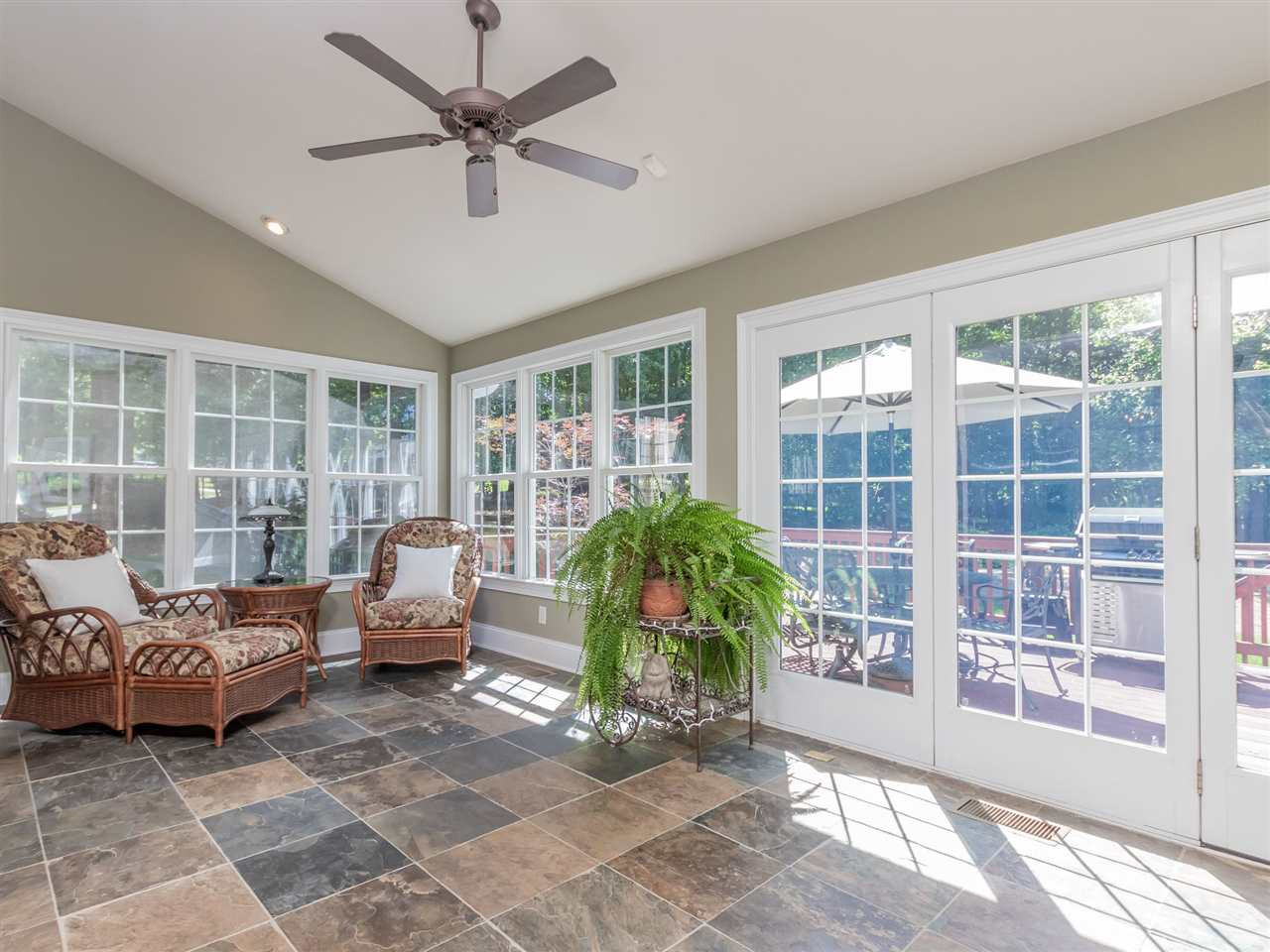 4717 Haleytree Court Raleigh, NC 27606 - Photo 13 of 30 What a wonderful space to relax with a cup of coffee in the morning! A room full of windows with a sweet view of the gorgeous back yard! Sunroom - Solarium
