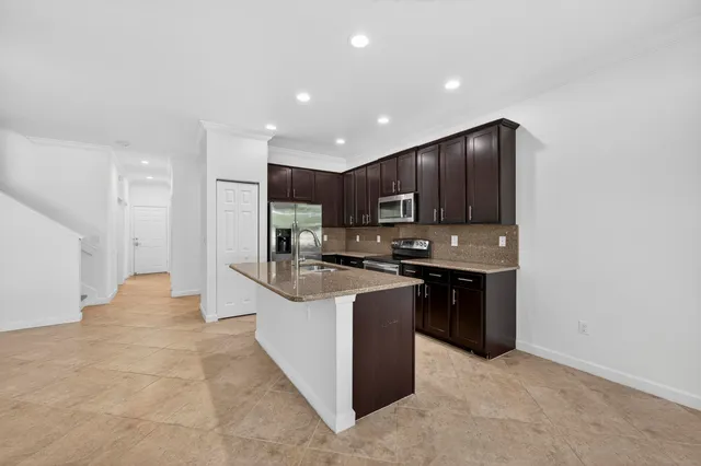 a view of a room with windows and entryway
