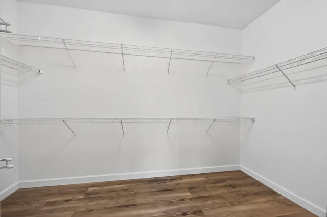 a bathroom with a tub a sink and a shower