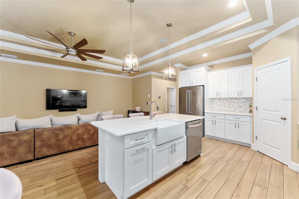 1788 Southwest 67th Circle Gainesville, FL 32607 - Photo 12 of 49 a large white kitchen with a stove and a refrigerator