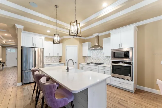 a kitchen with a sink stove and refrigerator