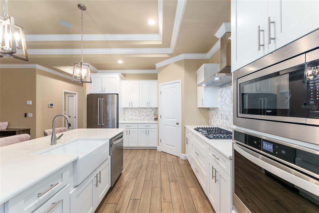 1788 Southwest 67th Circle Gainesville, FL 32607 - Photo 16 of 49 a kitchen with a sink stove and refrigerator