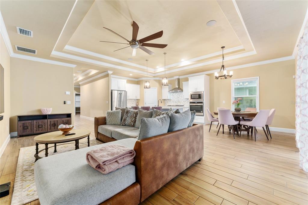 1788 Southwest 67th Circle Gainesville, FL 32607 - Photo 21 of 49 a living room with furniture and a wooden floor