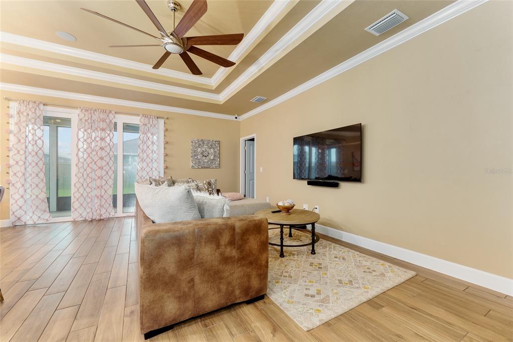1788 Southwest 67th Circle Gainesville, FL 32607 - Photo 24 of 49 a living room with furniture and a flat screen tv