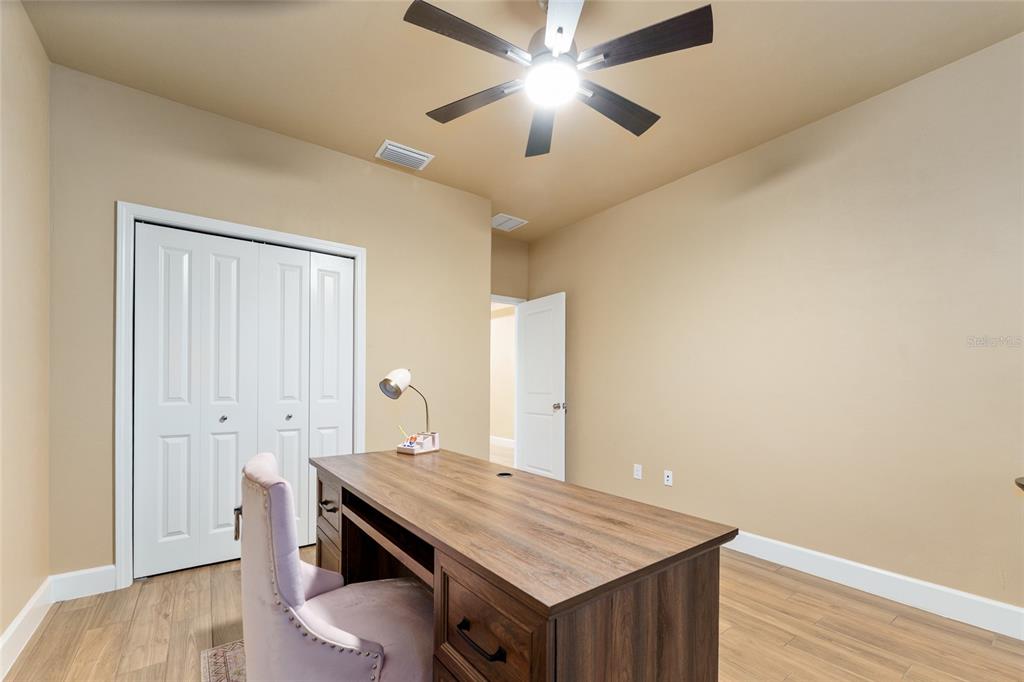 1788 Southwest 67th Circle Gainesville, FL 32607 - Photo 30 of 49 a view of kitchen island with wooden floor