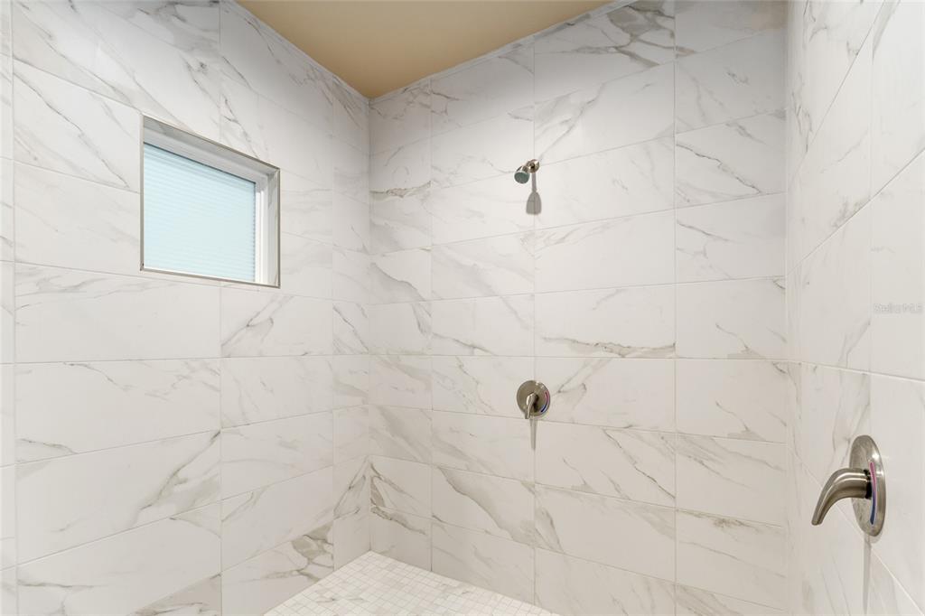 1788 Southwest 67th Circle Gainesville, FL 32607 - Photo 31 of 49 a bathroom with a shower