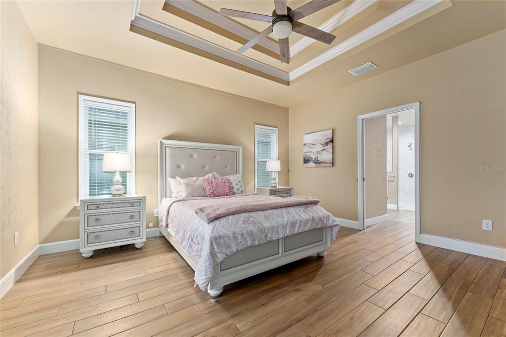 1788 Southwest 67th Circle Gainesville, FL 32607 - Photo 34 of 49 a bedroom with a bed chandelier and a window