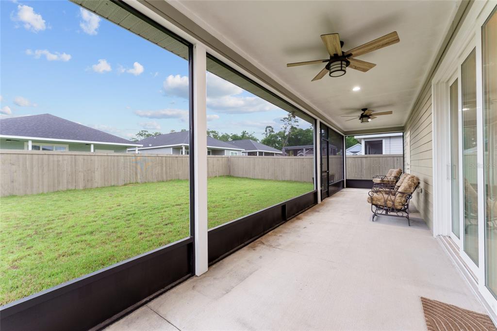 1788 Southwest 67th Circle Gainesville, FL 32607 - Photo 42 of 49 a view of a porch with furniture and a yard